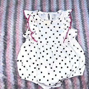Beautiful white and black polk-a-dot romper with pink trimmings.
